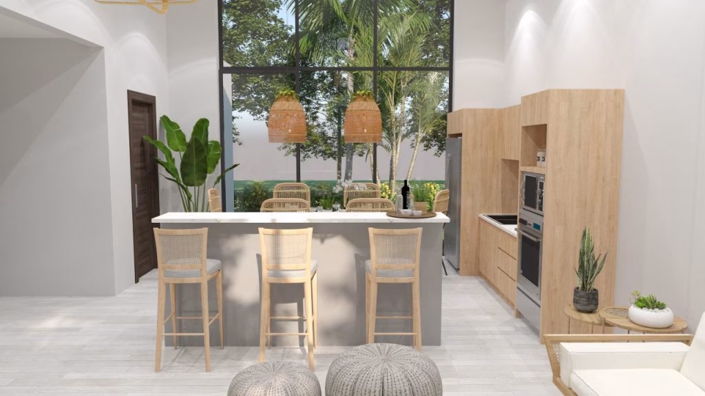 Modern kitchen with light wood cabinets, a white island and barstools, woven pendant lights, and lush views—a perfect fit for those browsing Kampot homes for sale. Indoor plants and natural light create a fresh, airy feel.
