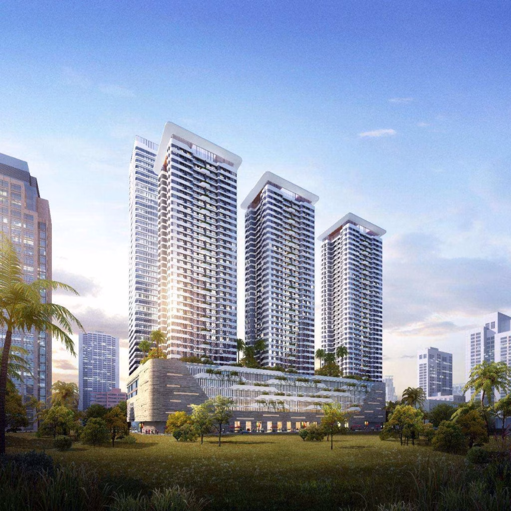 Three modern high-rise buildings with glass facades stand side by side against a blue sky in Sihanoukville, surrounded by greenery and city structures—an ideal studio for sale, connected by a lower podium featuring rooftop gardens.