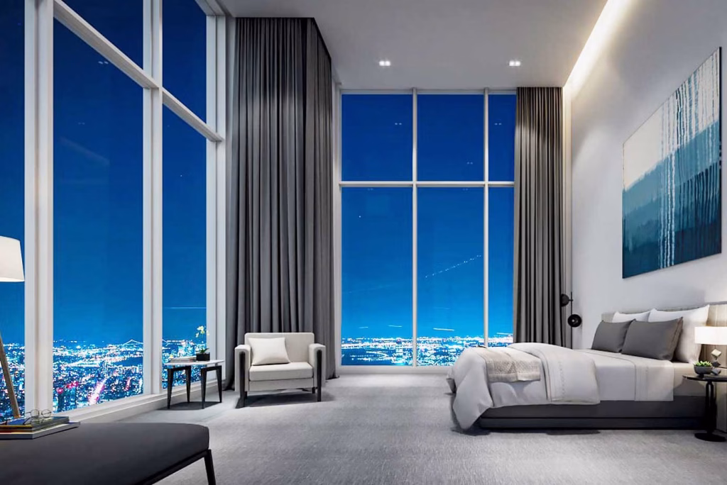 Modern bedroom with floor-to-ceiling windows showcases a cityscape at night. Perfect for New Projects, the space features a bed, armchair, side tables, large abstract art, and long gray curtains for a sleek and luxurious atmosphere.