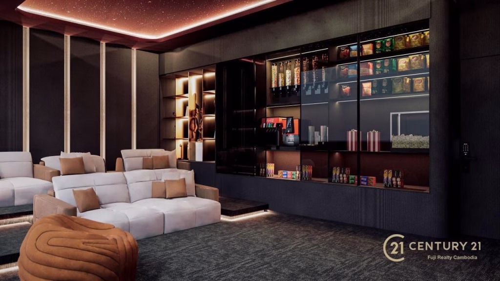 A modern Time Square 6 home theater room with white couches, a brown accent chair, built-in shelves with decorative items, and a snack bar. The dim lighting and starry ceiling set the mood, with the Century 21 logo in the corner.